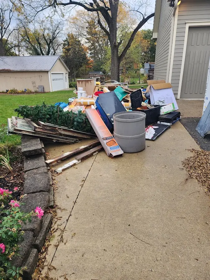 Dumpster being loaded with debris for 3 Yard Dumpster Rental in Modesto